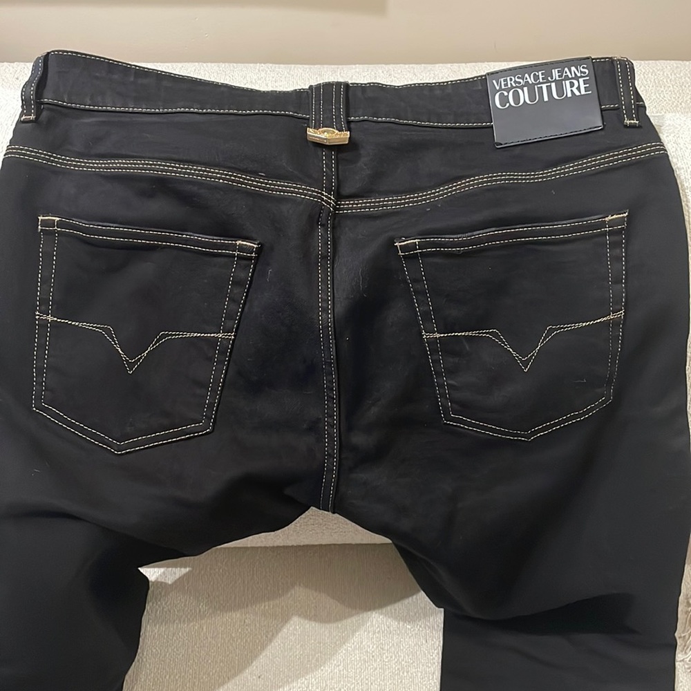 Almost new pair of Black Versace jeans
